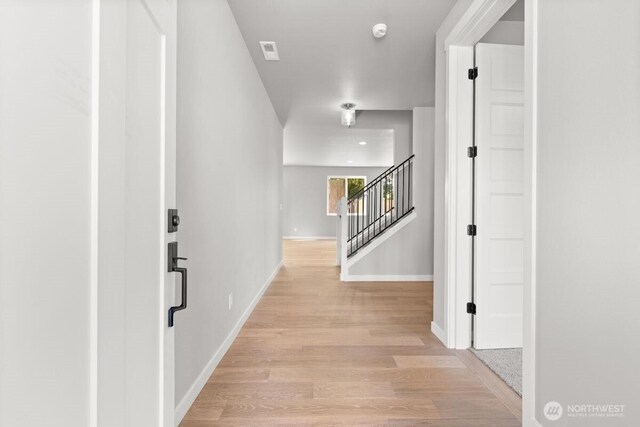 7332 284th St NW, Stanwood, WA 98292 - hallway with light wood finished floors and stairway