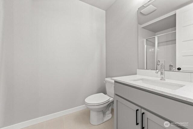 7332 284th St NW, Stanwood, WA 98292 - bathroom with vanity, a shower with door, and tile patterned floors
