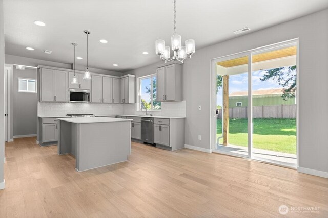 7332 284th St NW, Stanwood, WA 98292 - kitchen featuring appliances with stainless steel finishes, gray cabinetry, backsplash, and recessed lighting