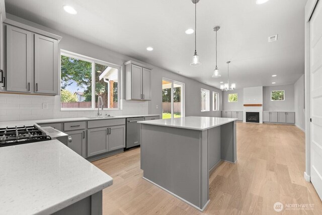 7332 284th St NW, Stanwood, WA 98292 - kitchen with gray cabinetry, tasteful backsplash, dishwasher, a kitchen island, and recessed lighting