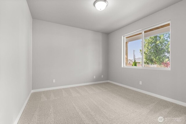 7332 284th St NW, Stanwood, WA 98292 - spare room featuring carpet flooring and baseboards
