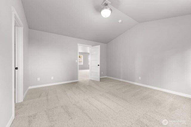 7332 284th St NW, Stanwood, WA 98292 - unfurnished bedroom featuring lofted ceiling and carpet floors