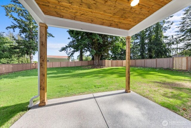 7332 284th St NW, Stanwood, WA 98292 - fenced backyard with a patio area