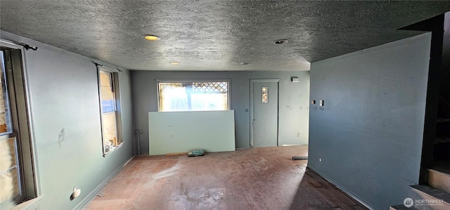 202 W 2nd Ave, Odessa, WA 99159 - unfurnished room featuring baseboards and a textured ceiling