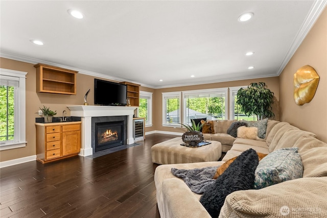 3237 Gravelly Beach Loop NW, Olympia, WA 98502 - living room with dark wood-style floors, baseboards, a fireplace with flush hearth, ornamental molding, and recessed lighting