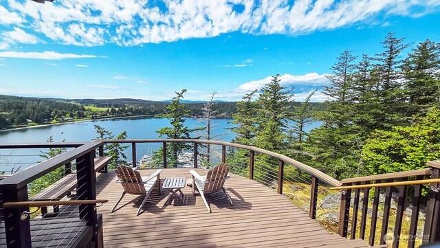 wooden terrace featuring a water view