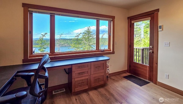 office with wood finished floors and baseboards