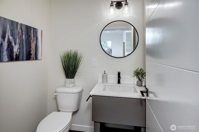 half bath with toilet and vanity