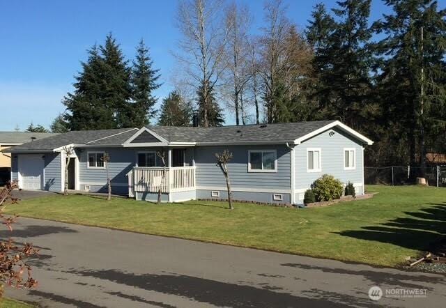 19009 99th Avenue Ct E, Puyallup, WA 98375 - ranch-style house with an attached garage, a front yard, and driveway