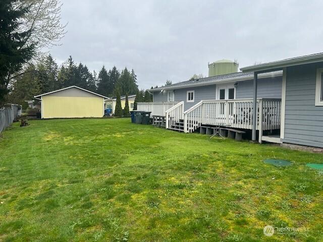 19009 99th Avenue Ct E, Puyallup, WA 98375 - view of grassy yard with a wooden deck