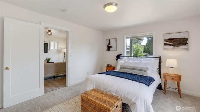bedroom with carpet flooring and baseboards