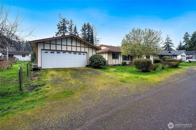 605 W Euclid Ave, Shelton, WA 98584 - view of front of property with board and batten siding, an attached garage, driveway, and a front yard