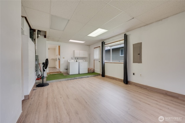 605 W Euclid Ave, Shelton, WA 98584 - below grade area with washing machine and dryer, electric panel, wood finished floors, a drop ceiling, and baseboards