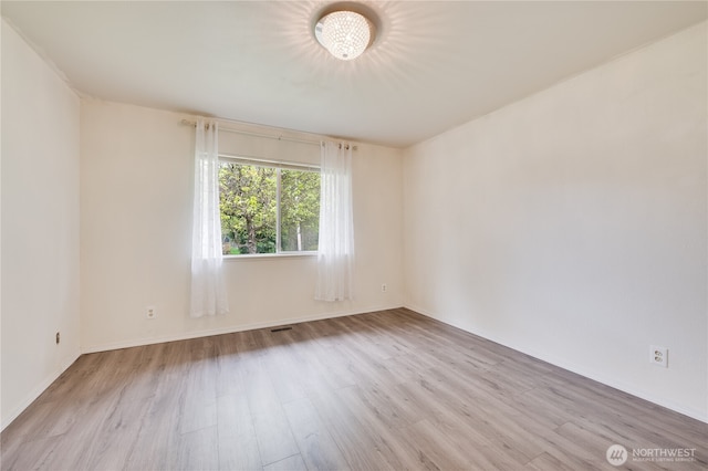 605 W Euclid Ave, Shelton, WA 98584 - unfurnished room featuring wood finished floors and baseboards