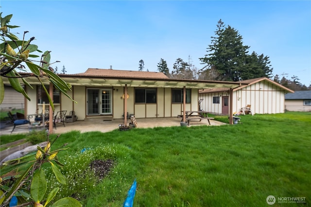 605 W Euclid Ave, Shelton, WA 98584 - rear view of house with a yard, a patio, and stucco siding