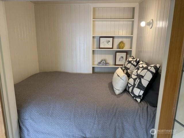 519 W Roy St Unit 309, Seattle, WA 98119 - bedroom featuring carpet floors and wood walls