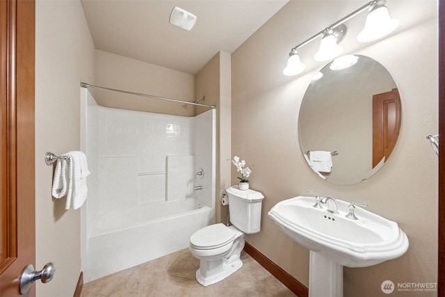 13809 172nd Pl E, Puyallup, WA 98374 - bathroom with toilet, tile patterned floors, bathing tub / shower combination, and baseboards