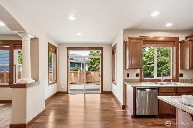 13809 172nd Pl E, Puyallup, WA 98374 - kitchen featuring dishwasher, a sink, ornate columns, recessed lighting, and dark wood-style floors