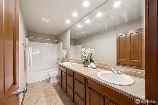 13809 172nd Pl E, Puyallup, WA 98374 - full bathroom featuring toilet, double vanity, recessed lighting, shower / bathtub combination, and tile patterned flooring