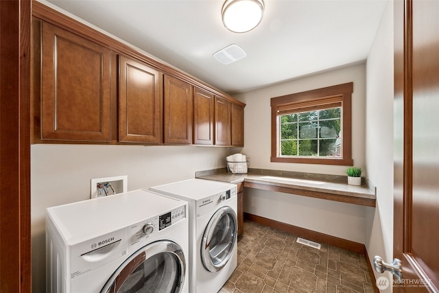 13809 172nd Pl E, Puyallup, WA 98374 - washroom with cabinet space, washing machine and clothes dryer, and baseboards