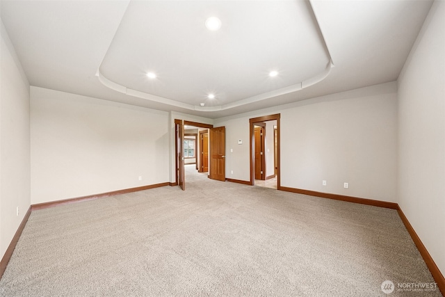 13809 172nd Pl E, Puyallup, WA 98374 - spare room with light carpet, recessed lighting, a tray ceiling, and baseboards