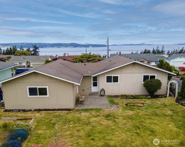 1068 Vista Del Monte, Camano Island, WA 98282 - rear view of house featuring a patio, a yard, and roof with shingles