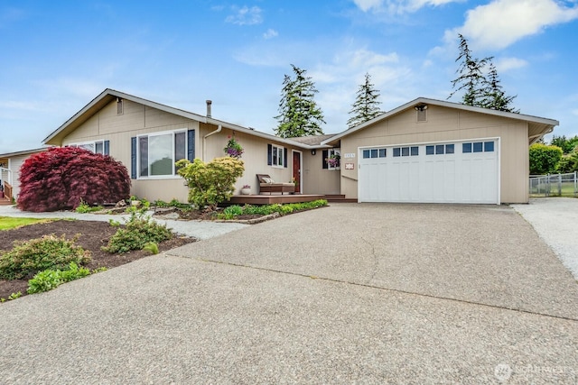 1068 Vista Del Monte, Camano Island, WA 98282 - single story home with concrete driveway, a garage, and fence