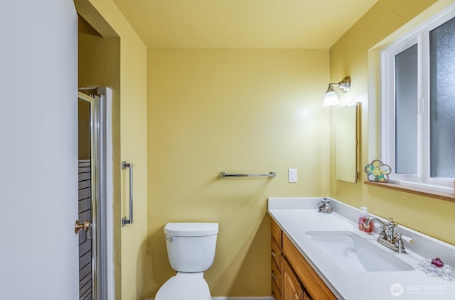 1068 Vista Del Monte, Camano Island, WA 98282 - bathroom with vanity, toilet, and an enclosed shower
