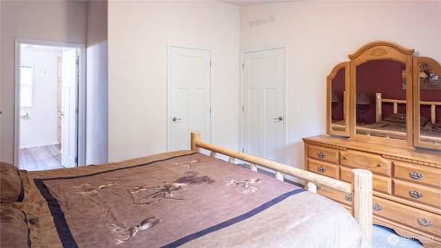 bedroom featuring wood finished floors