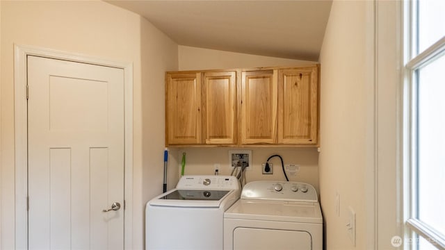 washroom featuring cabinet space and washer and dryer