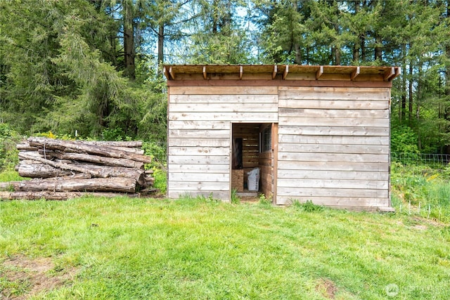 view of shed with fence