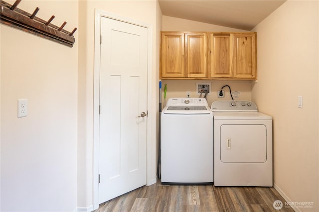 laundry room with cabinet space, wood finished floors, separate washer and dryer, and baseboards