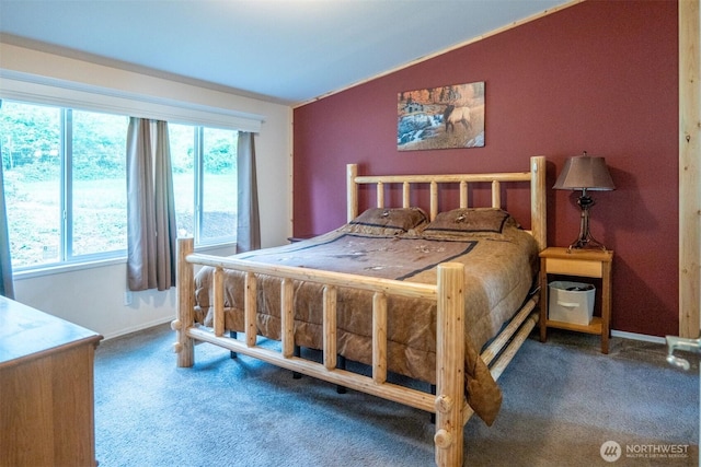 bedroom with carpet flooring, vaulted ceiling, and baseboards