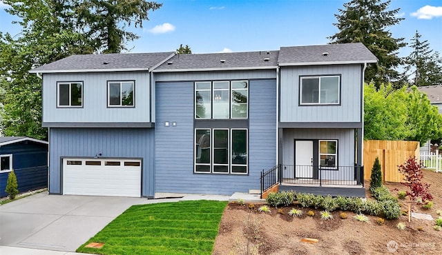 2900 NE 5th Pl, Renton, WA 98056 - view of front of house with fence, a garage, concrete driveway, and a shingled roof