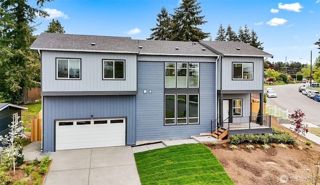 2900 NE 5th Pl, Renton, WA 98056 - view of front of home featuring an attached garage, driveway, and roof with shingles