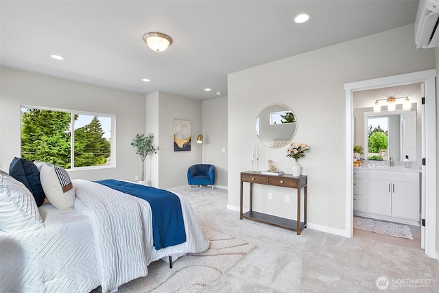 2900 NE 5th Pl, Renton, WA 98056 - bedroom with an AC wall unit, light carpet, recessed lighting, ensuite bath, and baseboards