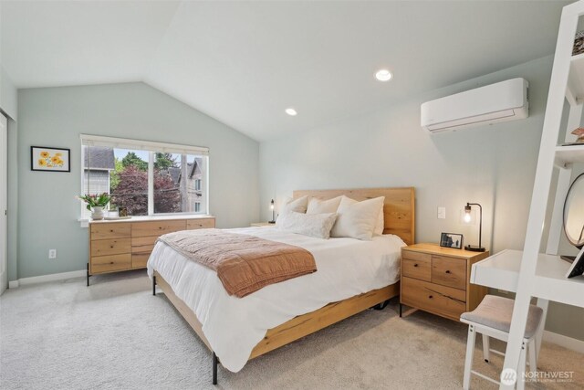bedroom with a wall mounted air conditioner, light carpet, vaulted ceiling, baseboards, and recessed lighting