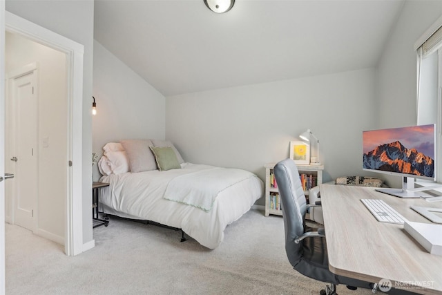 carpeted bedroom featuring vaulted ceiling, baseboards, and an office area