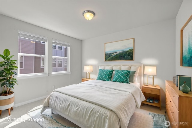 bedroom featuring carpet flooring and baseboards