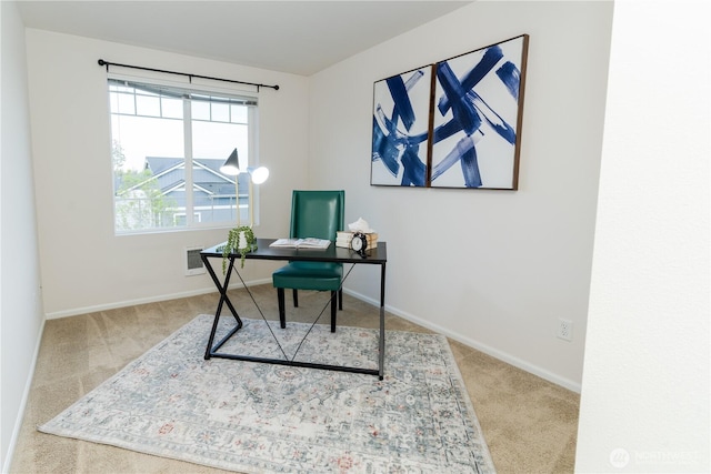 office space featuring carpet floors and baseboards