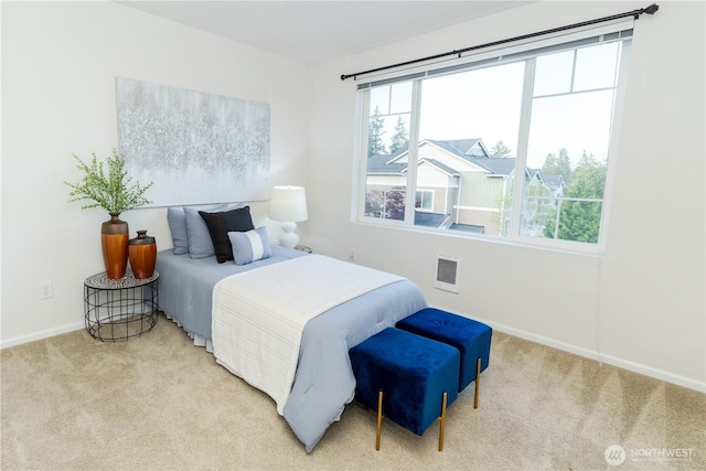 bedroom featuring carpet and baseboards