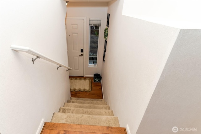 stairs with wood finished floors