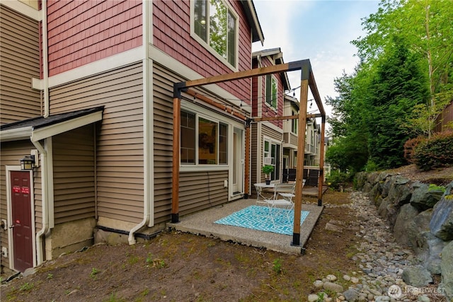 view of property exterior featuring a patio area