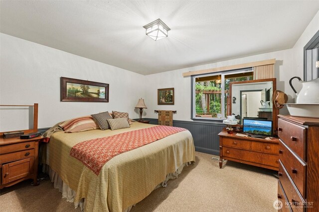 2124 213th Street Ct E, Spanaway, WA 98387 - bedroom featuring light colored carpet, radiator, and a wainscoted wall