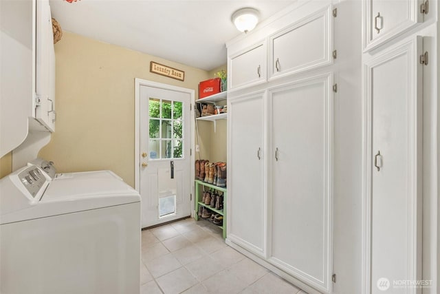 2124 213th Street Ct E, Spanaway, WA 98387 - laundry room featuring cabinet space, washing machine and clothes dryer, and light tile patterned floors
