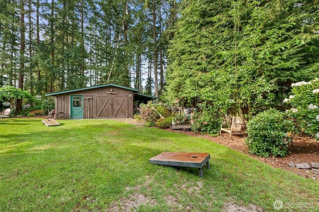 2124 213th Street Ct E, Spanaway, WA 98387 - view of grassy yard with an outdoor structure, a garage, and a storage unit