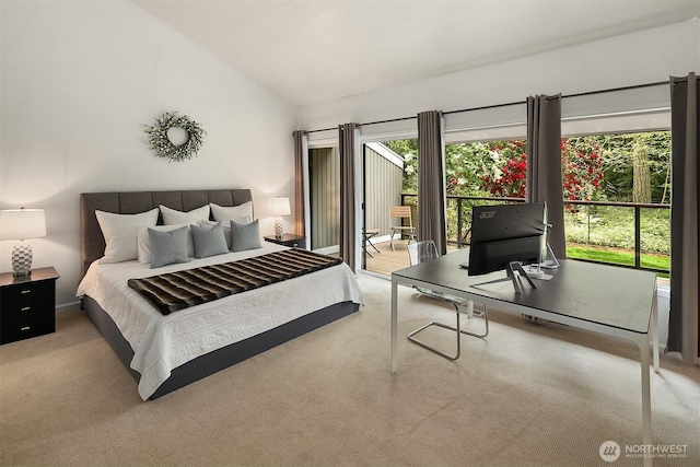 carpeted bedroom featuring lofted ceiling, access to exterior, and a desk