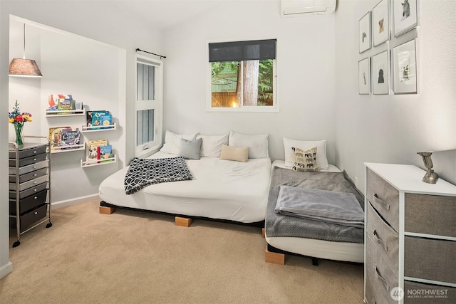 bedroom featuring a wall mounted AC, carpet, and baseboards