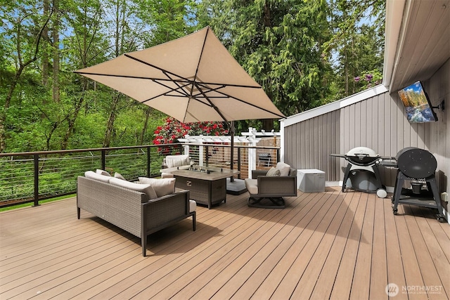 wooden terrace with an outdoor hangout area