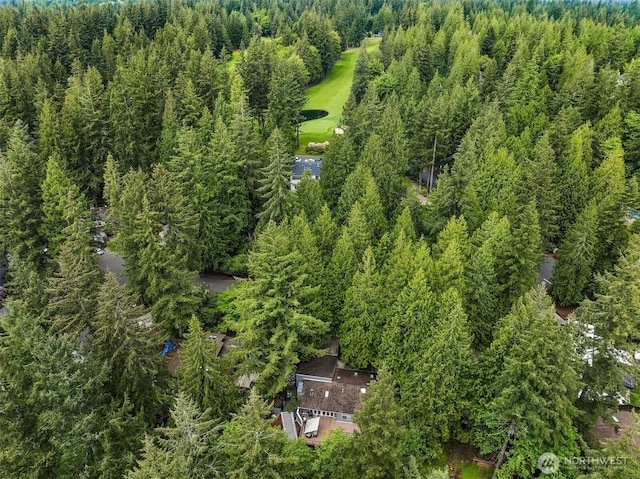 view of property location featuring a heavily wooded area